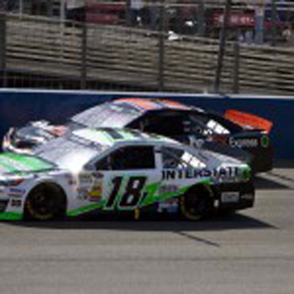 Kyle Busch (18) passes Denny Hamlin (11) early in the race, but the two were still battling it out until the final lap. Photo by Daniel Knighton