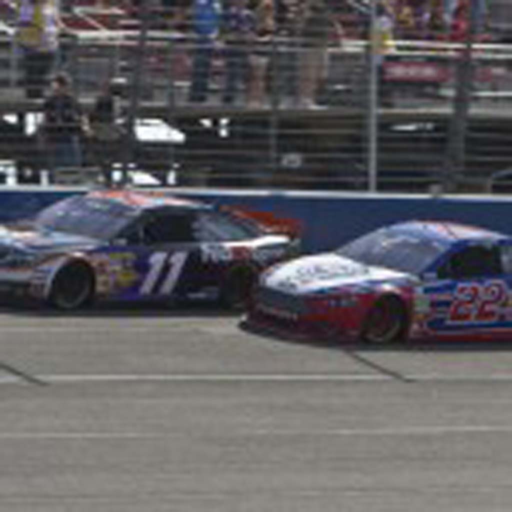 Denny Hamlin (11) and Joey Logano (22) go head-to head just prior to their collision between turns 3 and 4 that sent Hamlin to the hospital. Photo by Daniel Knighton