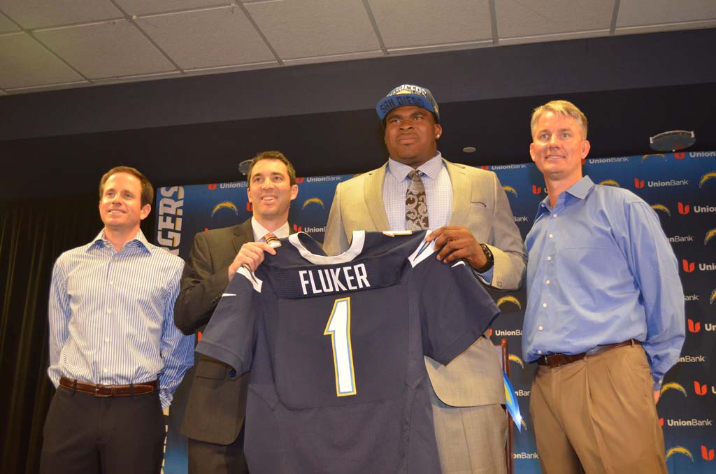 From left: Chargers Executive Vice President Michael Spanos, General Manager Tom Telesco, D.J. Fluker and Head Coach Mike McCoy. Fluker was the team’s first round pick in the 2013 NFL draft on Thursday. Photo by Tony Cagala