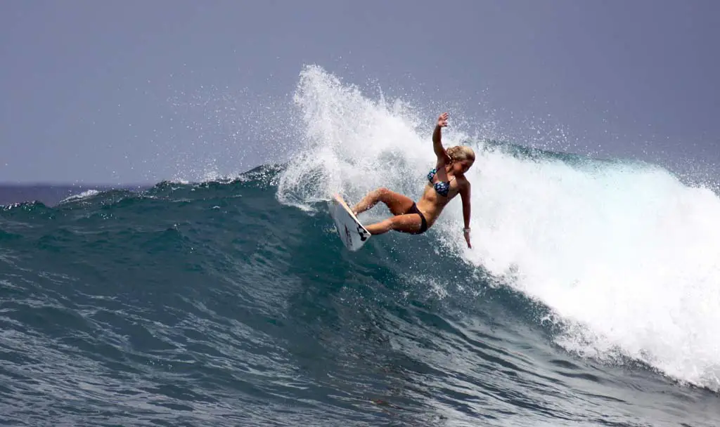 Kenzie Kessler surfs off of the coast of one of the Mentawai Islands in Indonesia. Photo by Geni Larosa