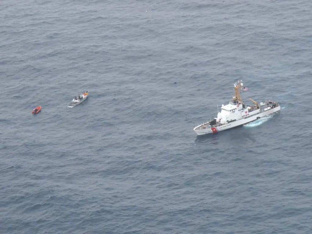 A boarding team deployed from U.S. Coast Guard Cutter Edisto approaches a suspected smuggling boat approximately 100 miles southwest of San Diego on June 18. The boat, its three passengers and the contraband were handed over to the Mexican navy for further enforcement action. Photo courtesy of U.S. Coast Guard by Air Station Sacramento