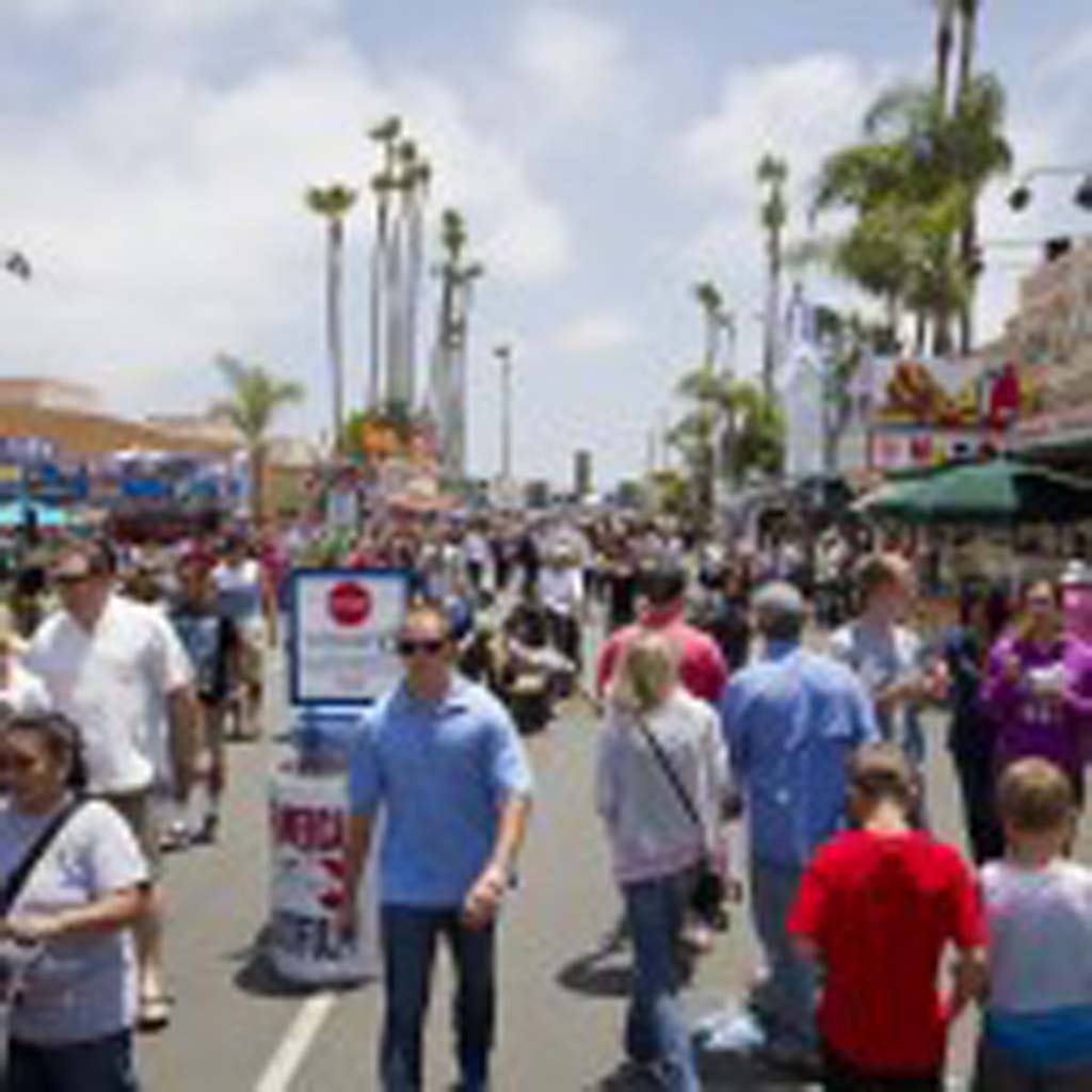 Visitors make their way down the Midway on opening day at the San Diego County Fair in Del Mar. Photo by Daniel Knighton