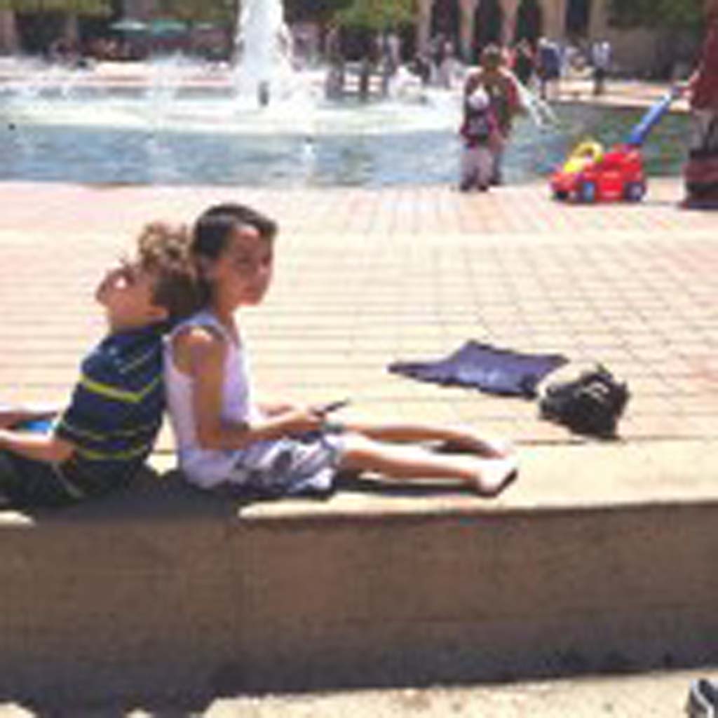 David Ondash (left) and Jordan Barnhart, 6-year-olds from Carlsbad, dry off in the sun after an unplanned dip in the fountain just outside of the San Diego Natural History Museum in Balboa Park. Visitors who want to return to present day after visiting the museum’s Ice Age exhibit will find lots of interesting things to see and do on the Prado, the park’s pedestrian promenade that runs through the center of museum row. photo by E’Louise Ondash