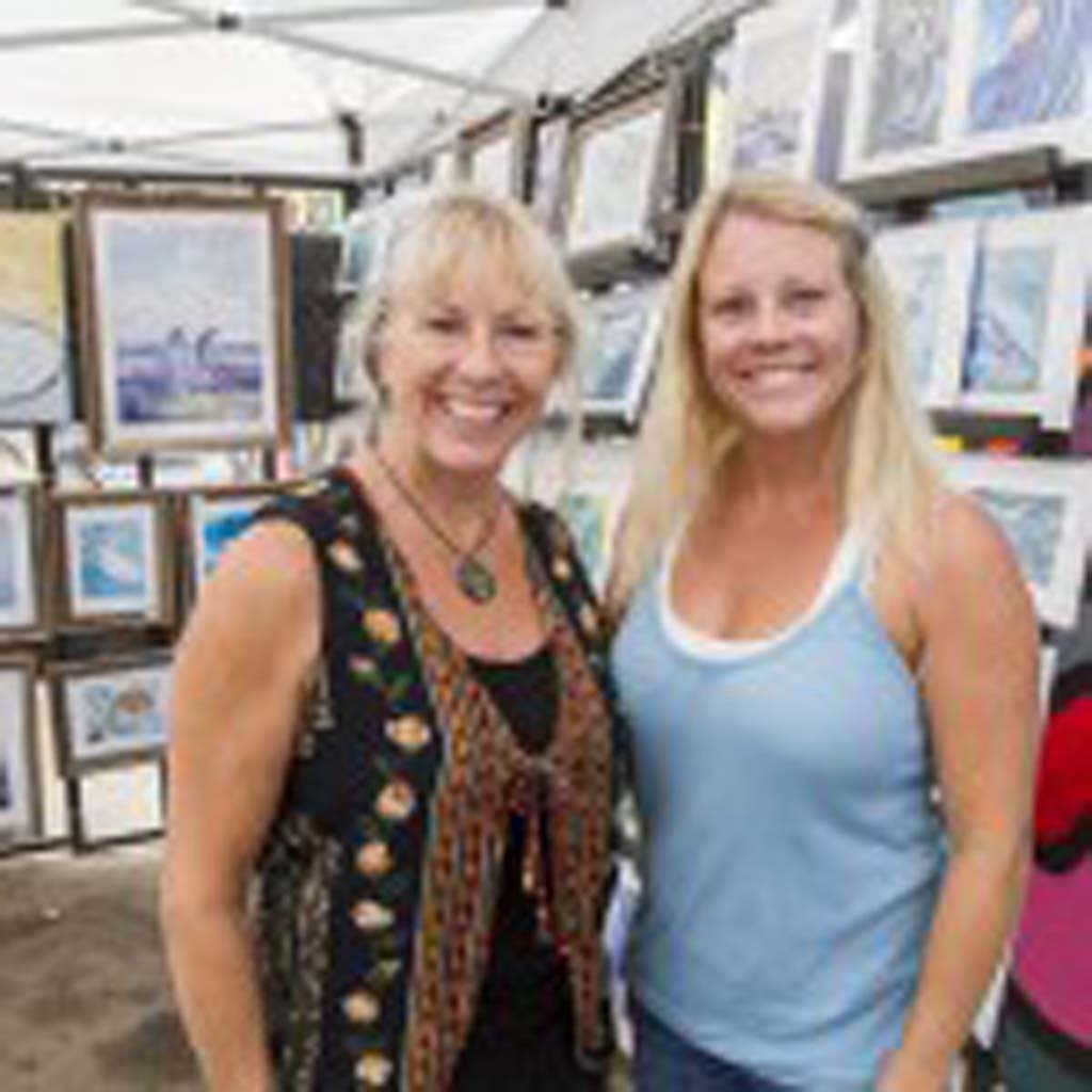 Oceanside artists Dotty Reiman and Tamara Kapan enjoy their 5th year at the Art Walk. Together, the Art Divas have an exhibition opening in Carlsbad on Aug. 26. Visit their website www.ArtDivas.net for more details. Photo by Daniel Knighton