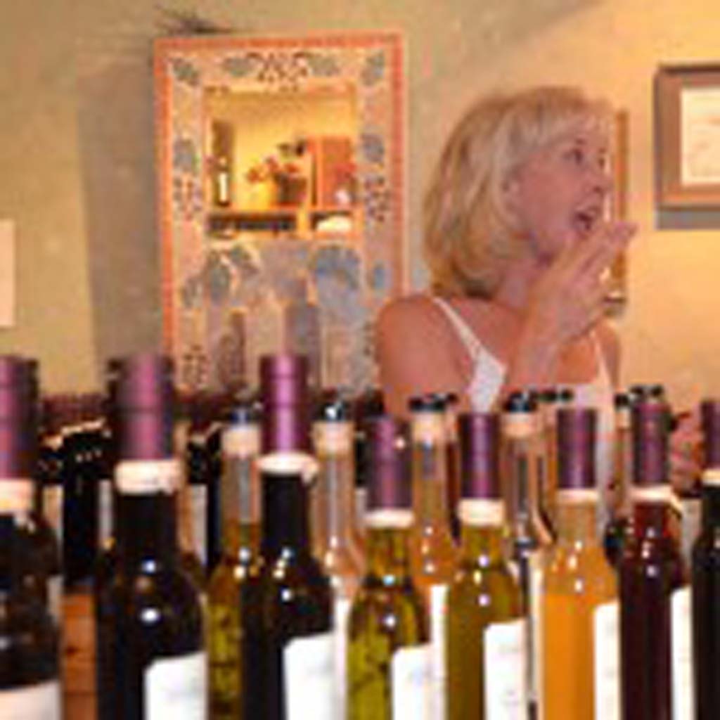 Catherine Pepe, co-owner of the Temecula Olive Oil Company, lectures a group visiting the store on what makes their olive oil delicious and unique. The shop offers hand-crafted olive oils in flavors like fresh basil, roasted garlic and citrus, and flavored balsamic vinegars such vanilla and fig, honey and pomegranate. Try the 911 Hatch Chili Balsamic Bianco if you dare. There also is a Solana Beach store (342 S. Cedros Ave; 858-847-9007), and one in San Diego Old Town’s Fiesta Reyes (619-269-5779). (Photo by E’Louise Ondash)