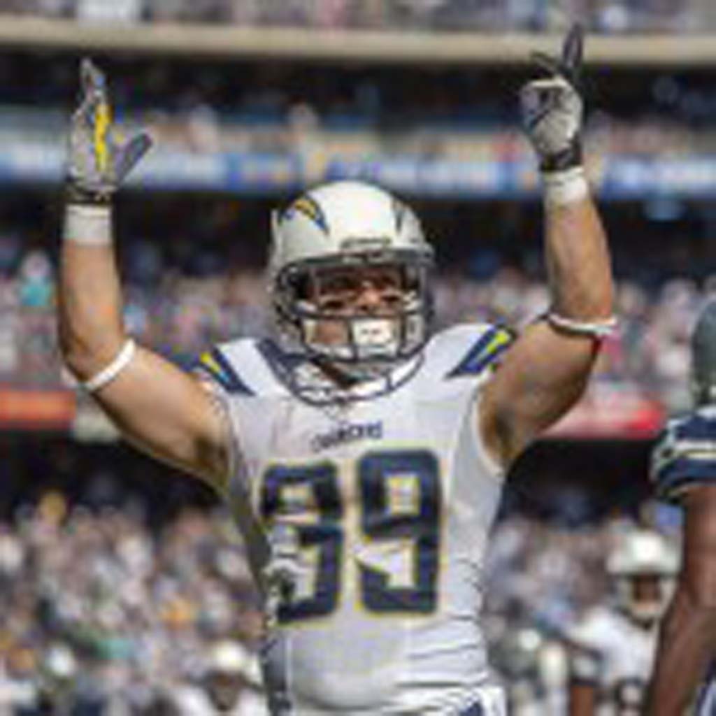 Chargers running back Danny Woodhead raises his arms in celebration after scoring his second touchdown of the game. Photo Bill Reilly