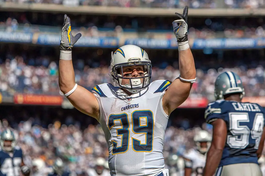Chargers running back Danny Woodhead raises his arms in celebration after scoring his second touchdown of the game. Photo Bill Reilly