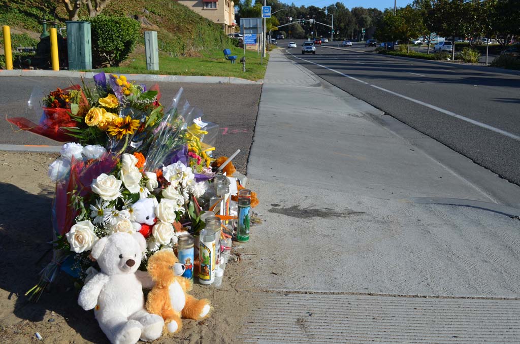 A memorial was set up on Encinitas Boulevard in honor of 3-year-old Juan Ruiz, who was struck and killed by a car Nov. 1. Hours after, Sheriff’s deputies reported that the collision was an accident. However, the Sheriff’s Department is now charging Agustin Morales with manslaughter and other counts. Photo by Jared Whitlock