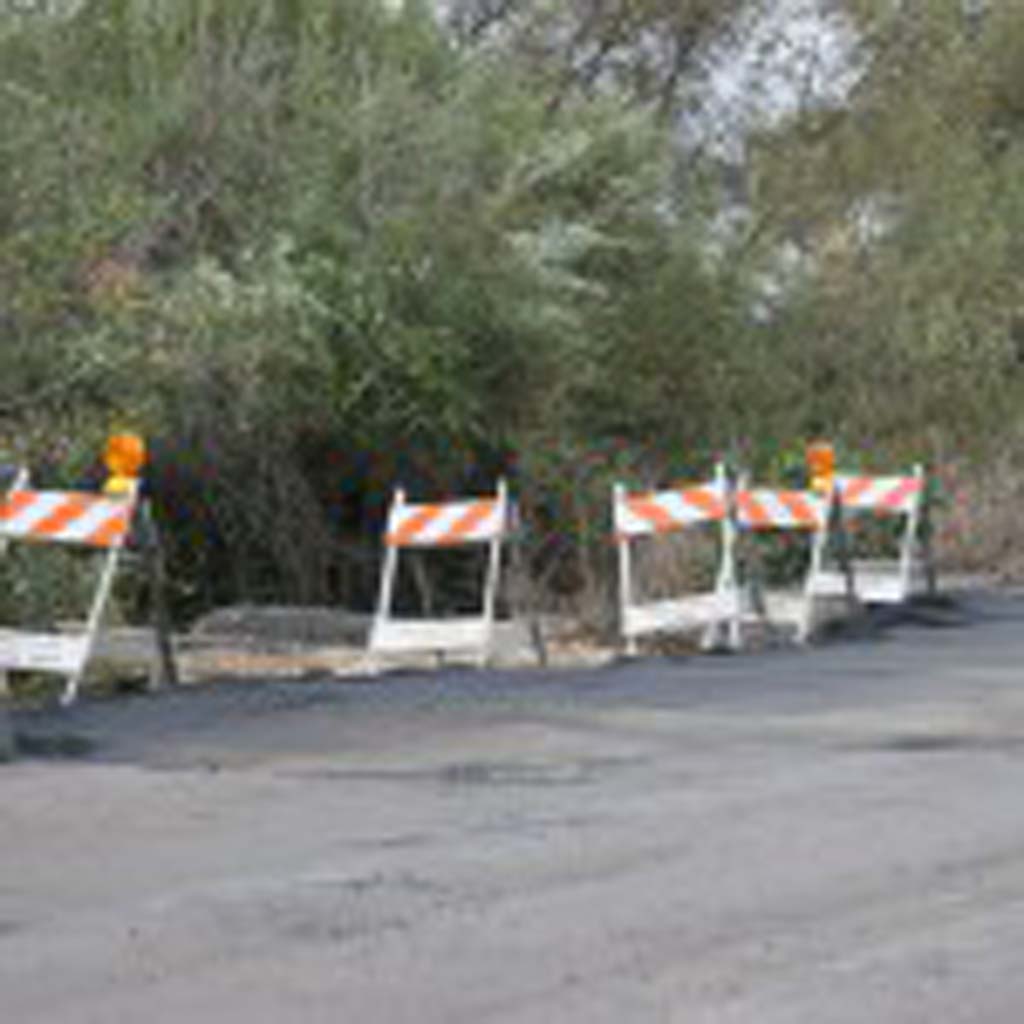In less than 24 hours a sizeable sinkhole on North River Road was repaired. The cause is thought to be corrosion of bolts on the drainline and main waterline. Photo by Promise Yee
