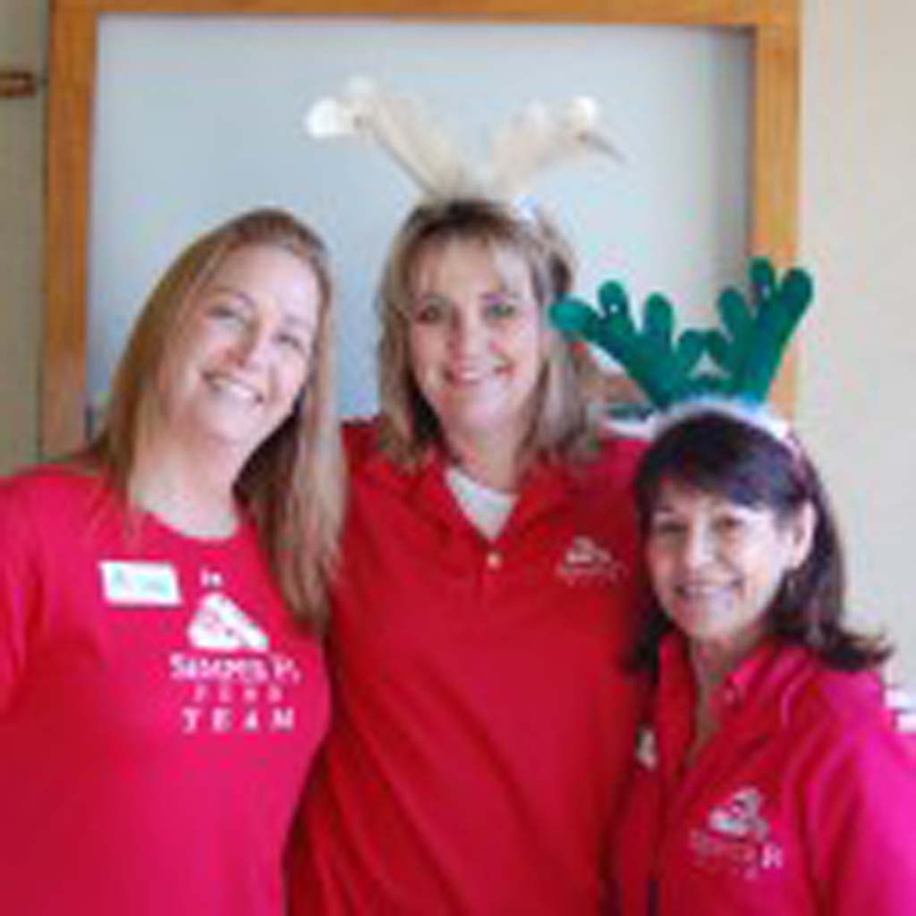 Volunteers, from left, Karen Kawachi, Kerri Jobe and Ester Rilea are with the Semper Fi Fund, an event beneficiary. Photo by Bianca Kaplanek