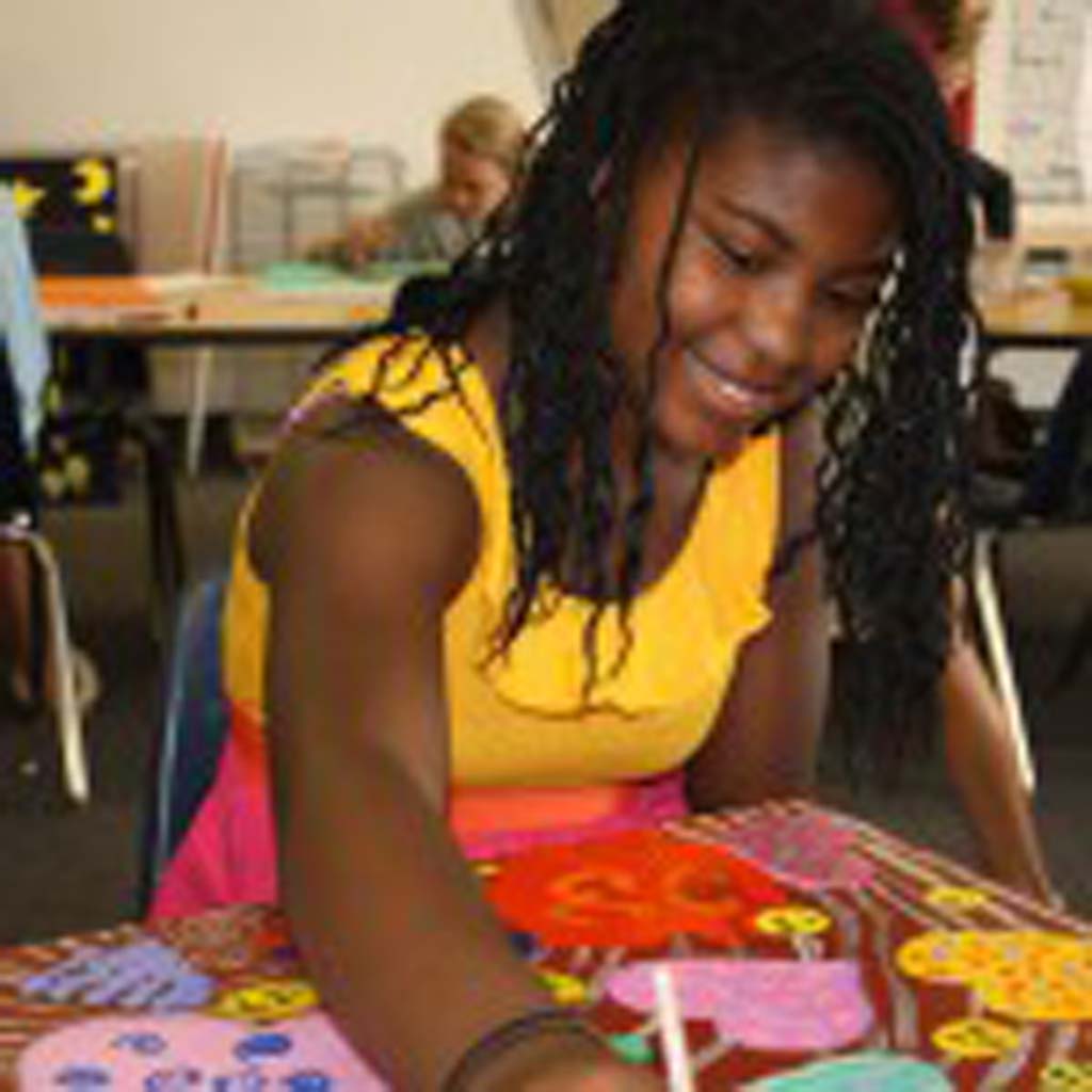 R. Roger Rowe Middle School student Aniah Edwards,11, puts the finishing touches on her artwork for the Hearts for Healing exhibition and auction to be held at L Street Fine Art Feb. 9. Courtesy photo
