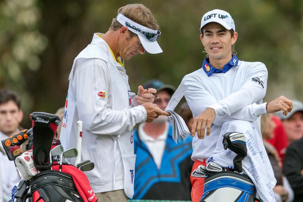 Camilo Villegas and his caddie make small talk while waiting to tee off of the 9th hole on Saturday at Torrey Pines. Photo by Bill Reilly