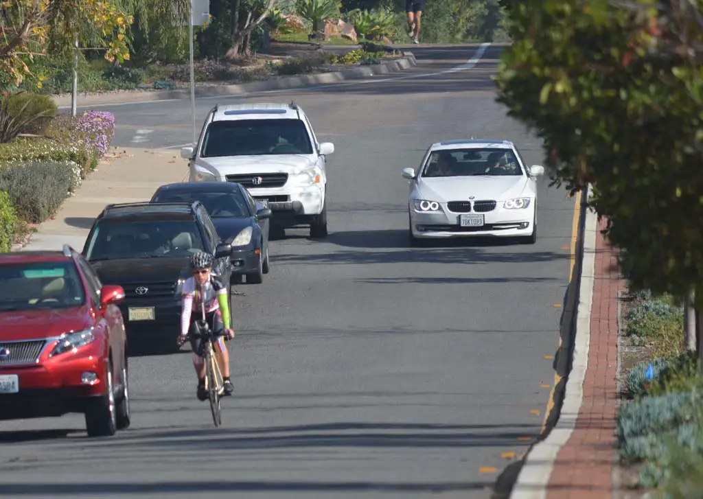 Bicyclists pedal down Paseo Delicias in Rancho Santa Fe where a portion of the street has no bike lane. The cyclists have caught residents’ attentions, and the Rancho Santa Fe Association has asked that California Highway Patrol enforce bicycle laws more. Photo by Tony Cagala