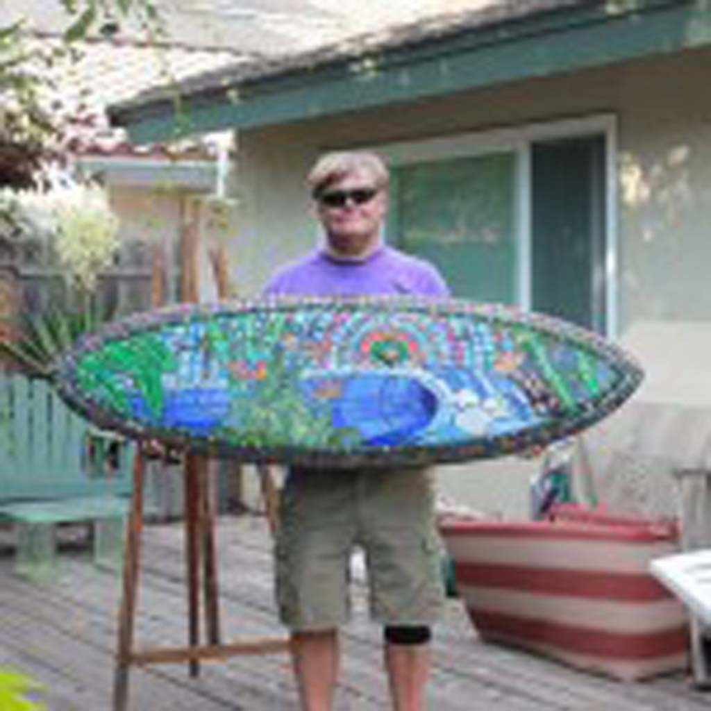 Billy Stewart with his surfboard art. Courtesy photo