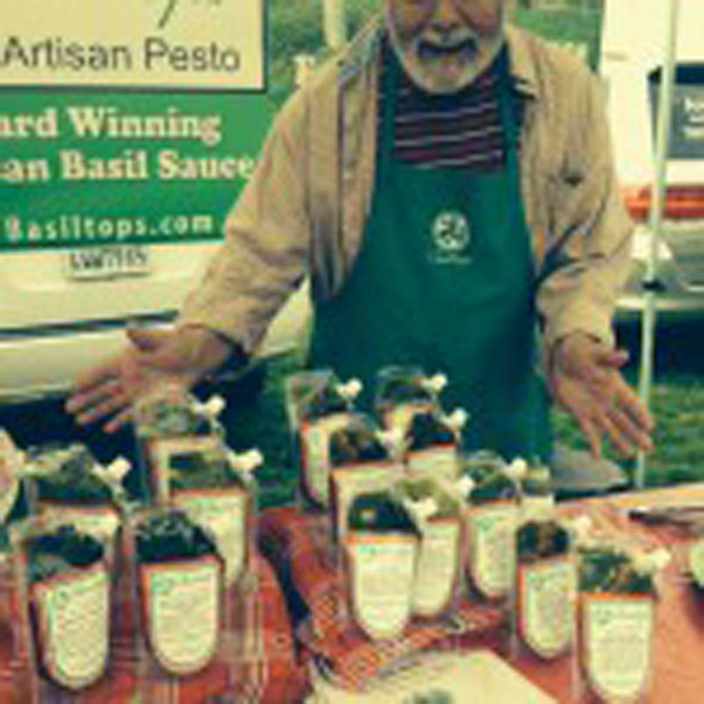 Barry Reid with his Basiltops Pesto offerings at the Leucadia Farmer’s Market. Photo by David Boylan