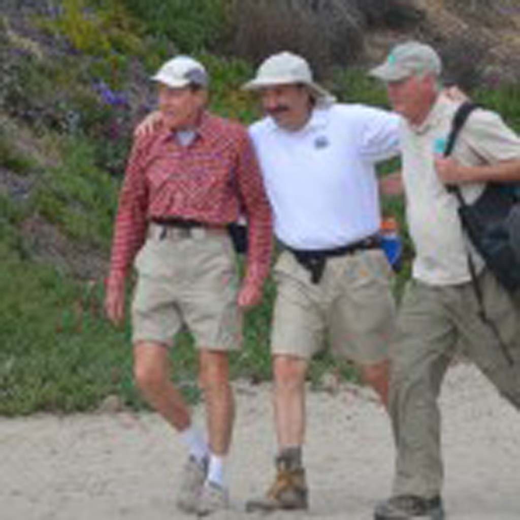 From left: Bill Simmons, Jim Cunningham and Dick Bobertz complete the final six miles of their more than 70-mile trek from the crest of Volcan Mountain to Del Mar’s Dog Beach. Photo by Yeshe Salz
