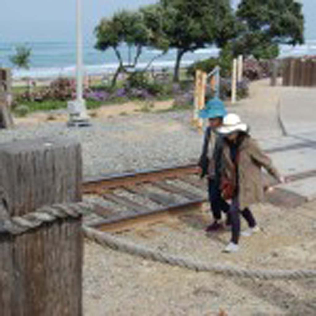 Two women begin a morning walk illegally along the railroad tracks. Photo by Bianca Kaplanek