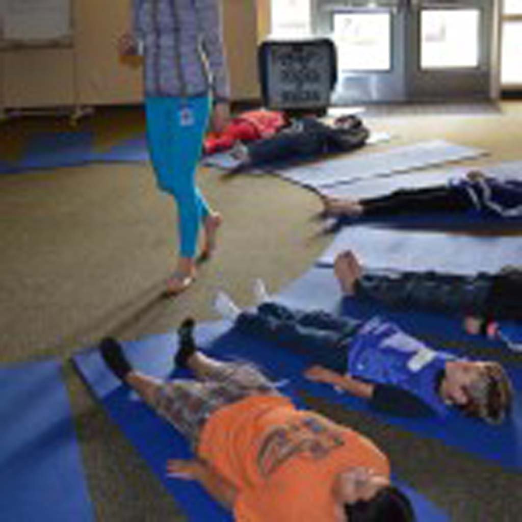 Students at Paul Ecke Central participate in a yoga class. Developed in Encinitas, the program has since spread to New York and Florida. File photo by Jared Whitlock