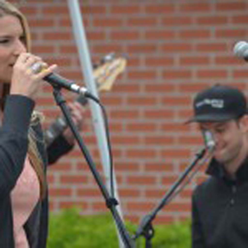 Tracey Stockalper, left, and brother Mike Stockalper of Mango Melody perform at the street fair. Photo by Tony Cagala