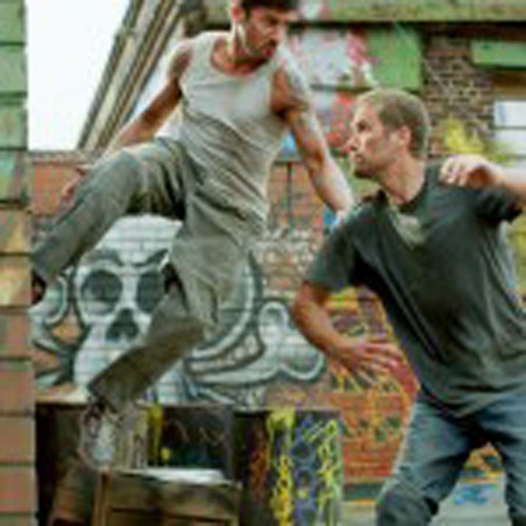 David Belle, left, and the late Paul Walker star in “Brick Mansions.” Photo by Philippe Bosse