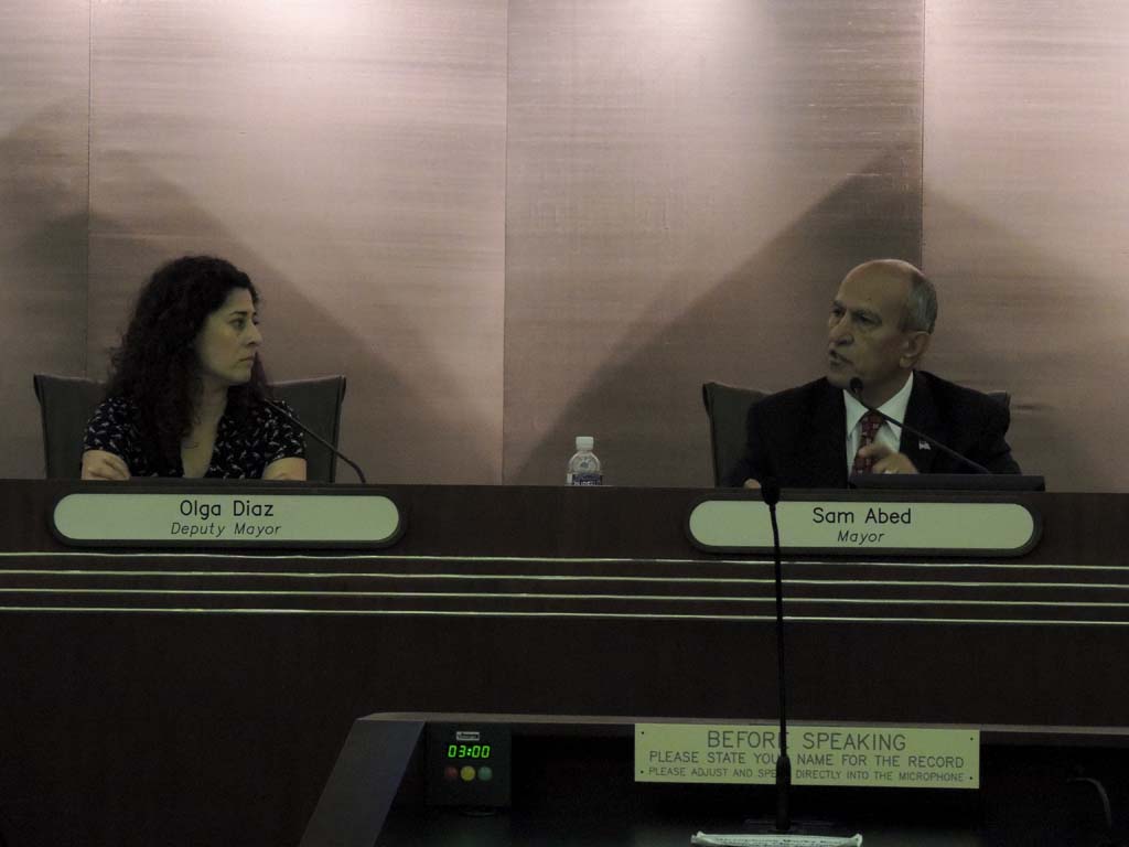 Escondido Deputy Mayor Olga Diaz, left, and Mayor Sam Abed discuss what power the City Council could have. Photo by Rachel Stine