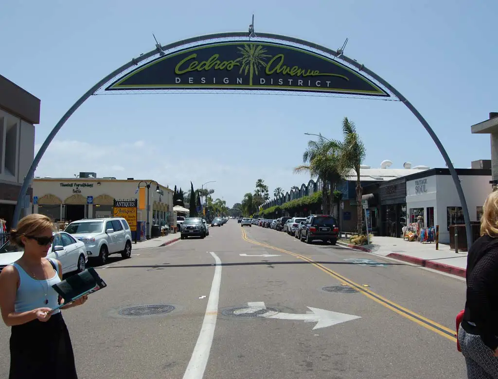 The iconic street arches installed in 1997 were designed to echo the curved silhouette of the Quonset huts along Cedros Avenue. Photo by Bianca Kaplanek
