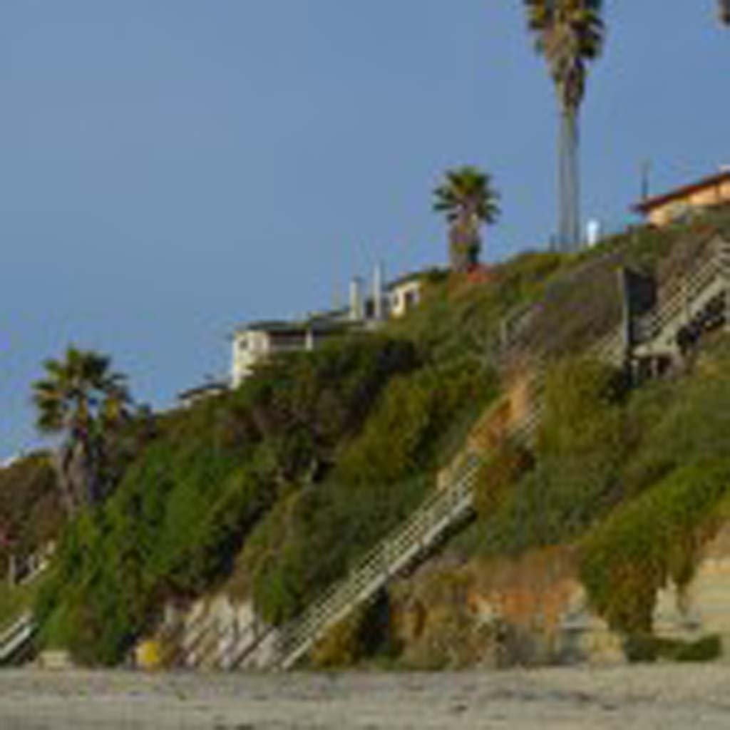 Homeowners built seawalls at Grandview Beach to combat bluff erosion. Recently, the Encinitas and Solana Beach sand project, which would shore up beaches, missed an important funding deadline. Photo by Jared Whitlock