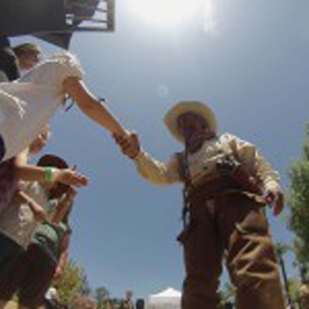 Cowboy "Curly Dan" shakes the hands of kids during the Wild West Days. Photo by Tony Cagala