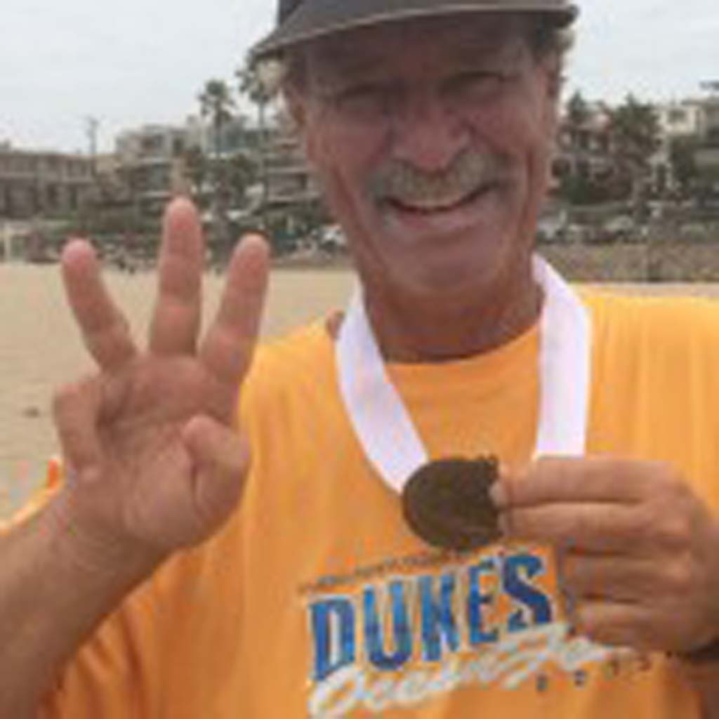 Del Mar BodySurfing Club member Bill "Froggy" Schildge shows off his Bronze Medal won in the Aug. 4 Legends Division of the International Bodysurfing Championship.