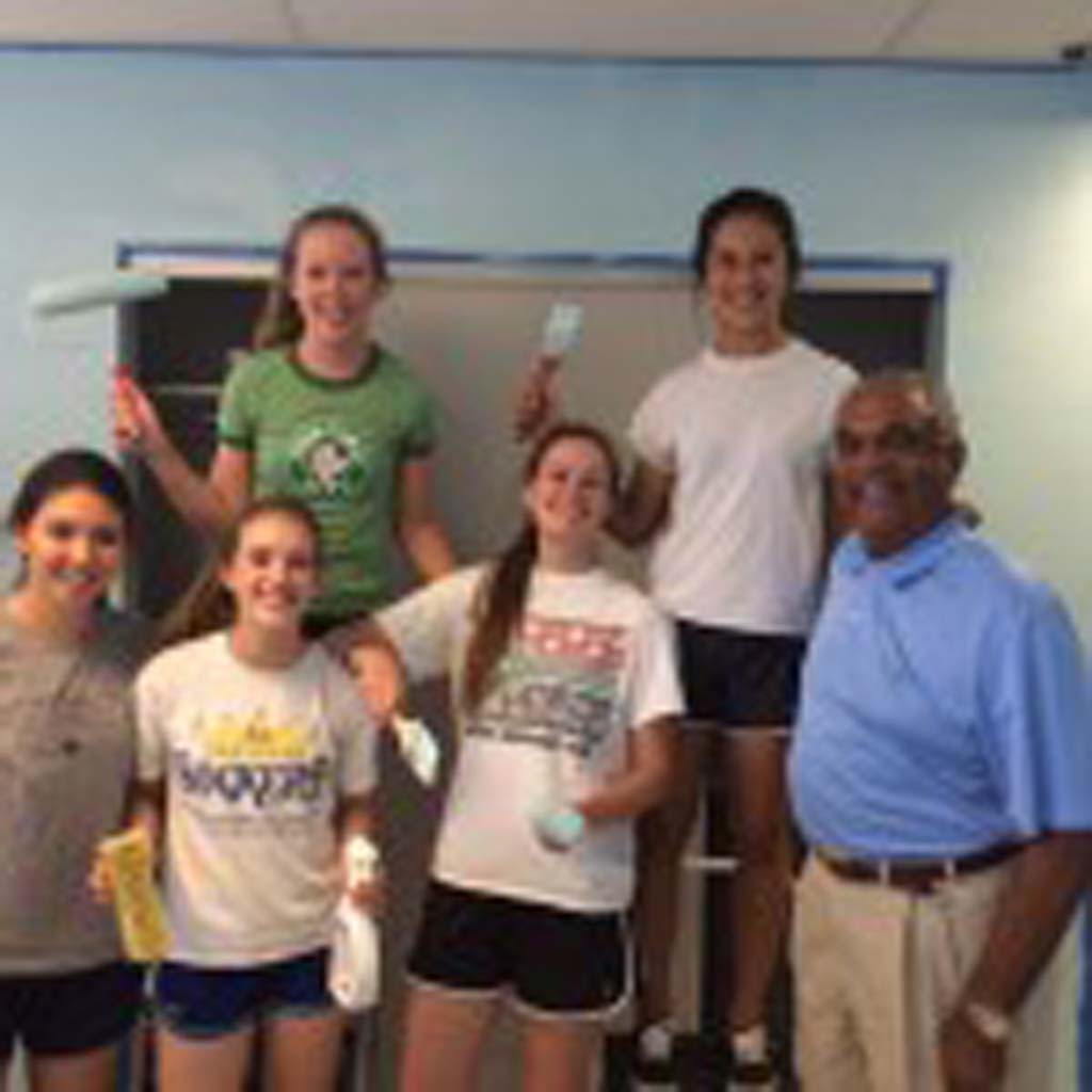 Taking a painting break, students, from left, Emma Daniels, Alexandra Carter, Britta Gullahorn, organizer Meghan Grogan and Keara Geckeler pose with San Diego Rescue Mission President/CEO Herb Johnson. Grogan’s partner, Margaret Zhao, is not shown. Courtesy photo