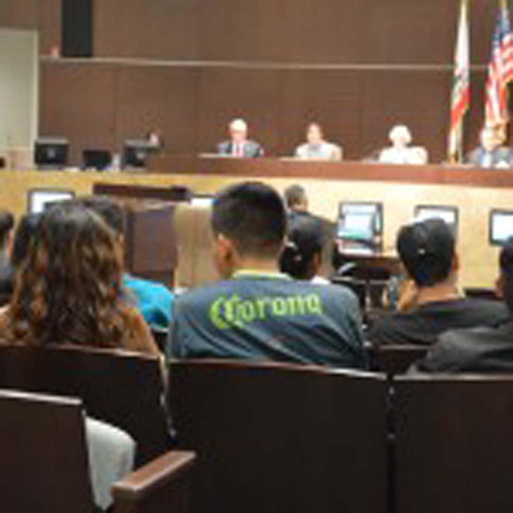 Students listen to Vista City Council members discuss whether to approve a permit for a 7-Eleven to sell alcohol. The Council voted 3-2 to approve the permit. Photo by Sandy Coronilla