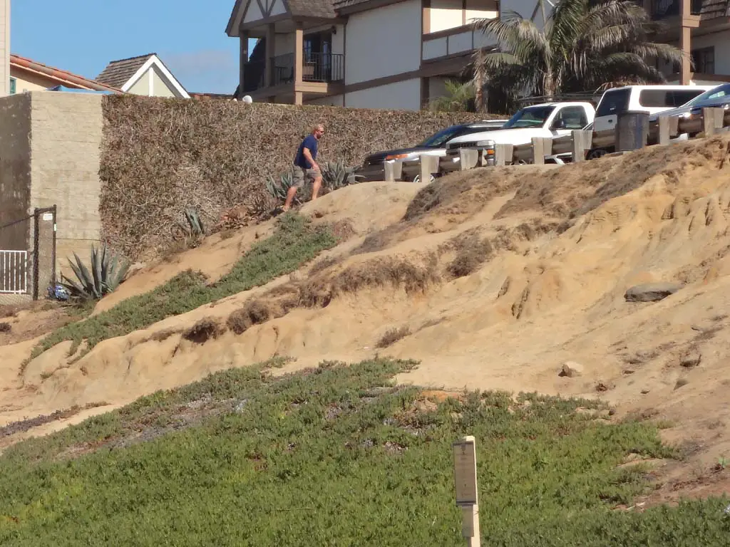 Bluff erosion is sped up when people use the face of the bluff to access the beach. City officials approved funding towards the addition of a low fence near the Ocean Street parking lot in order to minimize pedestrian access on the bluff. Photo by Ellen Wright