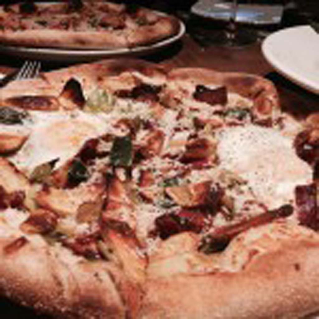 The sunny side up bacon and potato pizza is one of the newest pizzas on the California Pizza Kitchen’s menu. Photo by David Boylan