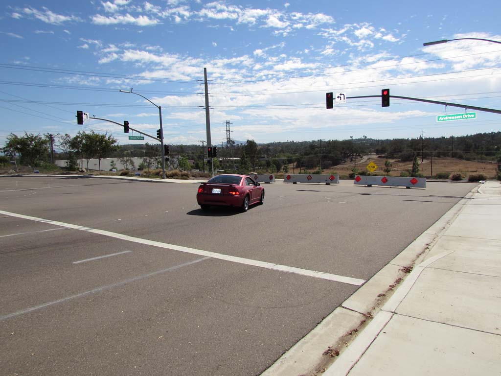 A commuter is forced to turn left onto Andreasen Drive at the end of Citracado Parkway. The proposed link will connect the parkway between Harmony Grove Village Parkway and Andreasen Drive. Photo by Ellen Wright.