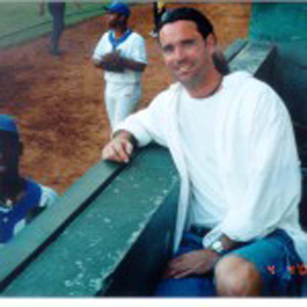 David Ondash of Carlsbad visits with a Cuban baseball player in Havana in 2000. The player wanted news about teammates who had defected to the United States. He said ball players never hear about fellow players after they leave Cuba. Courtesy photos