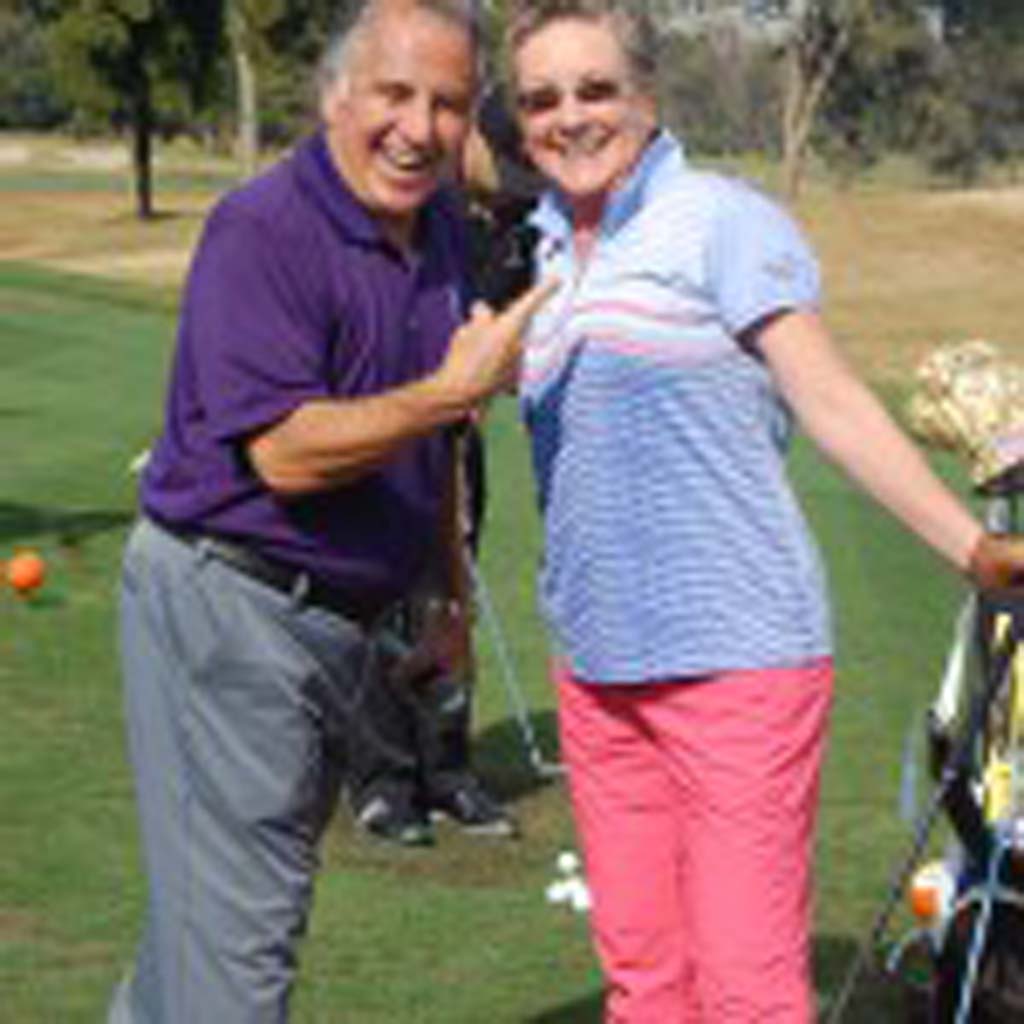 Operation Game On founder Tony Perez celebrates with Nancy Neglia, the first golfer and only woman to sink a hole-in-one during his inaugural 15-Inch Hole-in-One Cup Challenge that will benefit his program that provides golf lessons to combat-injured troops. Photo by Bianca Kaplanek