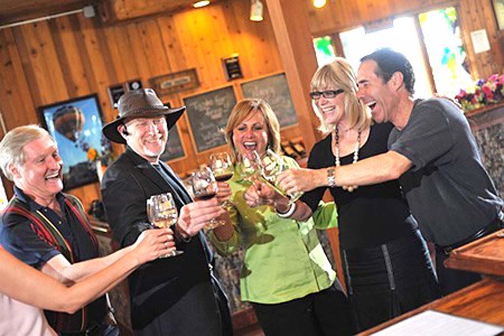 Falkner Winery owners Ray Falkner, far left, and Loretta Falkner, second from right, are in the middle of club member fun at their many events. Photo courtesy Falkner Winery