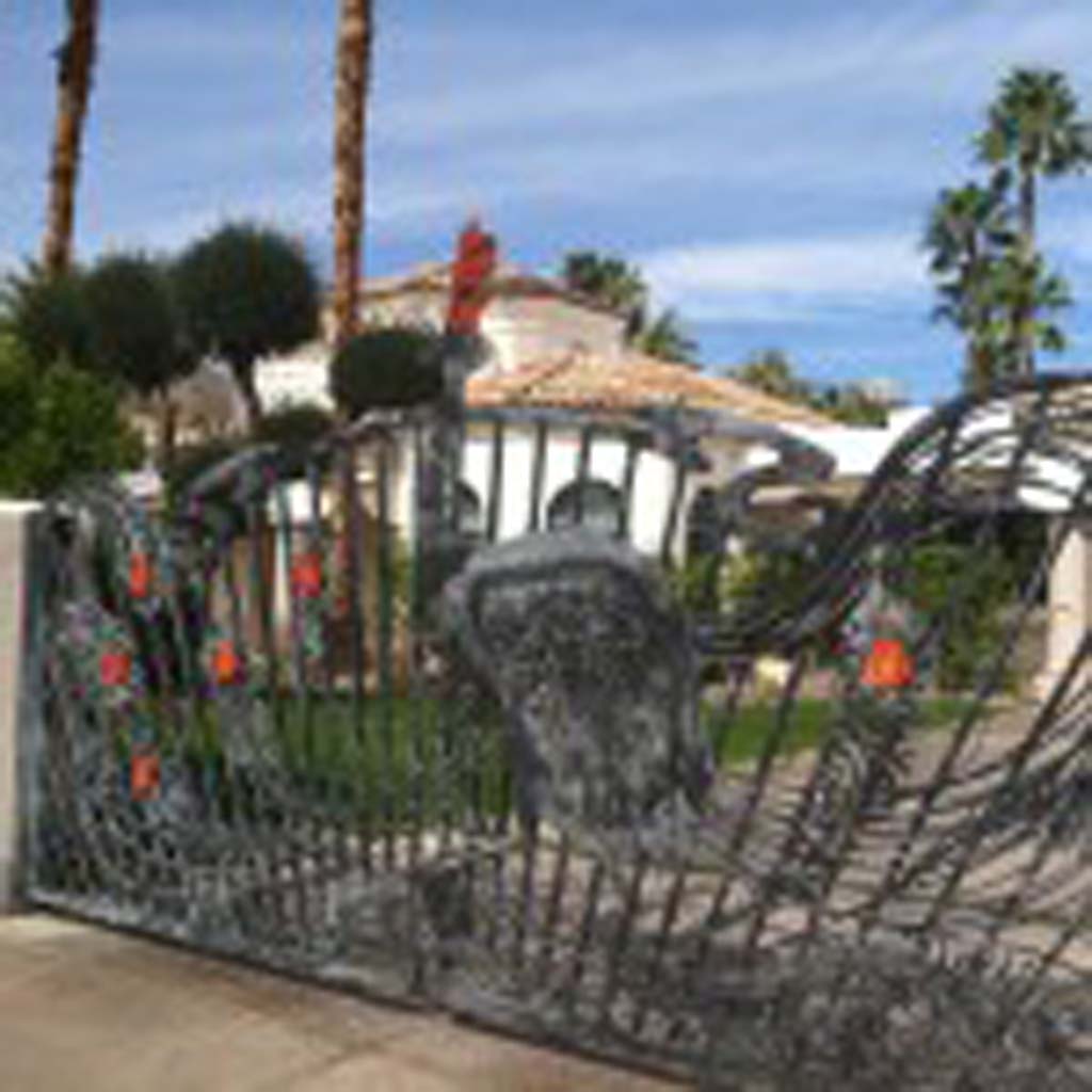 Jay Leno, in a nod to his long-time employer, NBC, had this peacock gate installed at his home in Old Las Palmas. The current owners decorate it for every season, according to local guide Kirk Bridgman. (E’Louise Ondash)