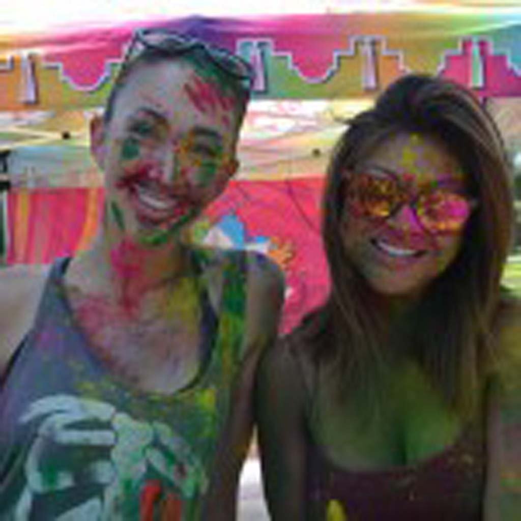 Dannie Fathman, left, and Tiffanie Damian at the Holi Festival of Colors at Escondido’s Grape Day Park. Photo by Tony Cagala