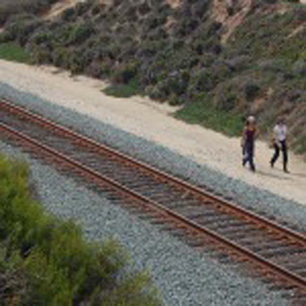 It is illegal to cross railroad tracks or walk between them and posted signs. North County Transit District in January instructed law enforcement officers to enforce trespassing on the tracks or it the right of way up and down the coast. Violators will be ticketed. File photo by Bianca Kaplanek