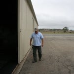 Rick Koehler, airport assistant manger, shows off refurbished hangars. Refurbishment is a fraction of the cost of rebuilding hangars. Photo by Promise Yee
