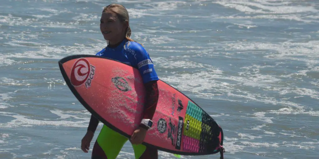 Alyssa Spencer, 12, is all smiles after competing against professional surfers, making it into the money round of the Paul Mitchell Supergirl Pro last weekend in Oceanside. Photo by Tony Cagala