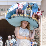 Rachel Burton of Del Mar shows off her hat in the paddock during opening day at Del Mar racetrack. Photo by Bill Reilly