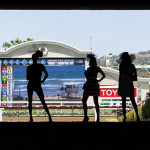 Spectators stop in the tunnel and look out to the scoreboard before the first race. Photo by Bill Reilly