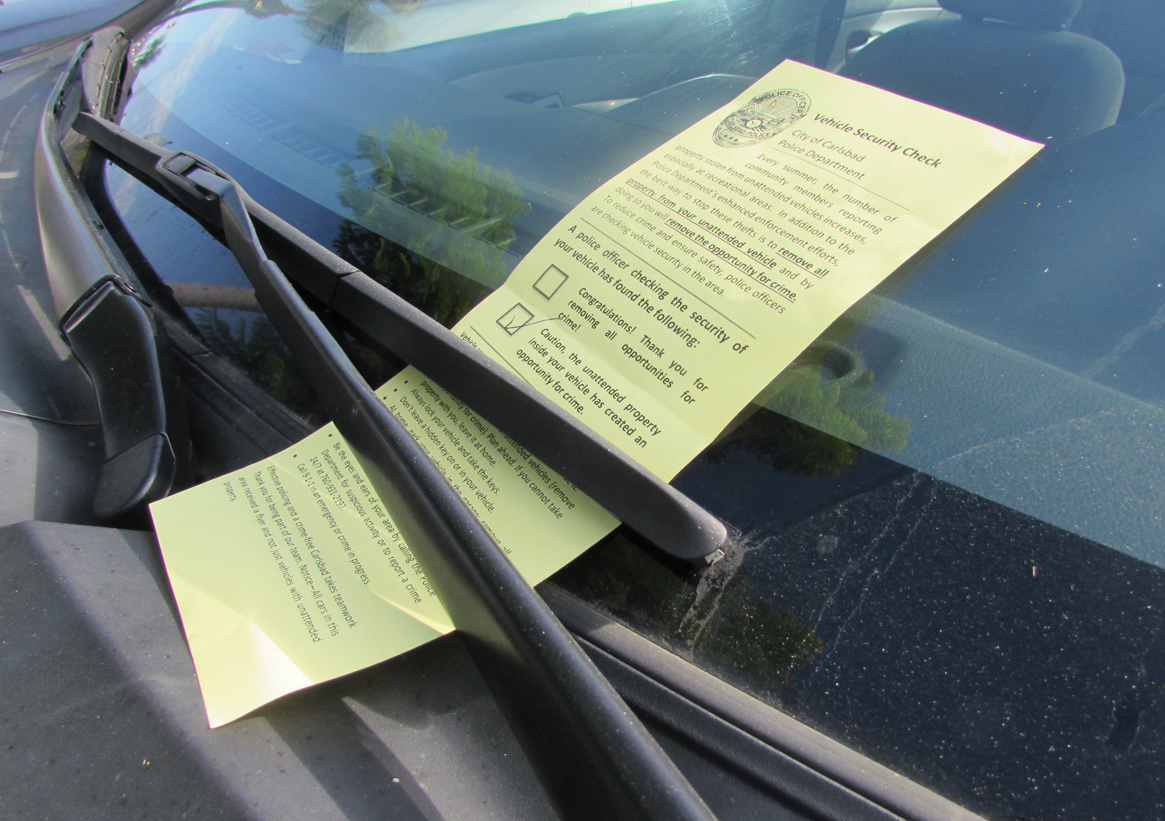 The Carlsbad Police Department is leaving pamphlets on cars in recreation areas to alert people whether or not their car is secure from crime. Photo by Ellen Wright