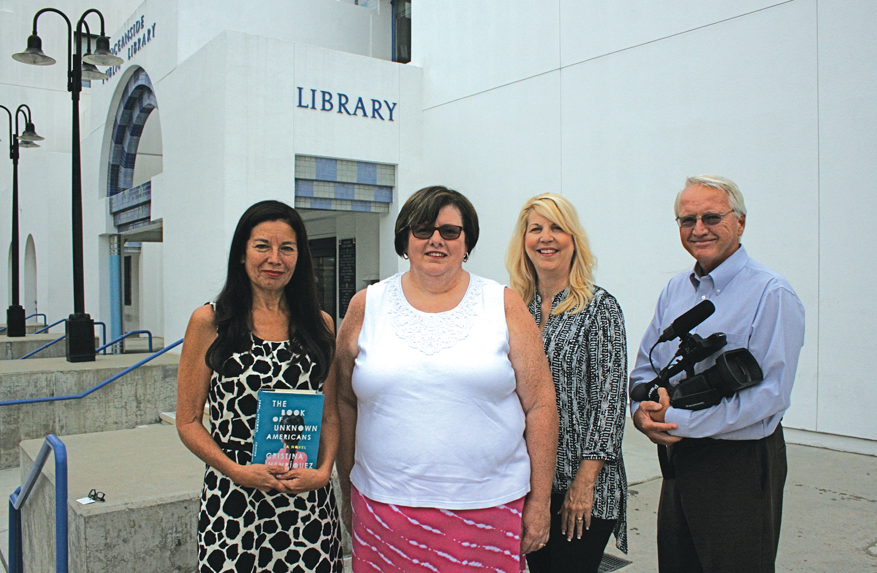 From left: Monica Chapa-Domercq, principal librarian, Sherri Cosby, library director, Kristi Hawthorne, Oceanside Historical Society president, and Tom Reeser, KOCT executive director, join forces to present programs on Latino history. The project will collect local first hand accounts and photos. Photo by Promise Yee