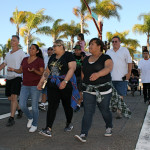 Dozens of people take part in a peace walk during National Night Out. The annual walk went down Pier View Way to the amphitheater. Photo by Promise Yee