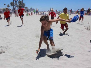 Junior Lifeguard, boys age 11 and under, compete in the capture the flag race. The competition marks the end of the first of two Junior Lifeguard sessions.