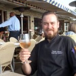 Poseidon Del Mar’s Chef de Cuisine is Travis Lawson, shown on the patio pavilion with the Pacific Ocean just steps away.  He’s enjoying a Ferrari-Carano Chardonnay.