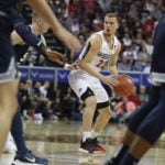 San Diego State men's basketball player Malachi Flynn dribbles the ball during a game.